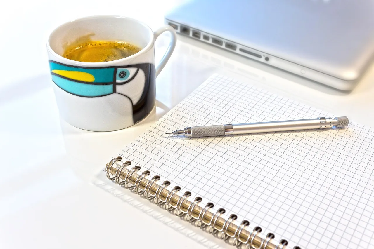pencil, writing or drawing device, mine, coffee cup, write, draw, sketch, note, sketch pad, spiral notebook, notepad, checkered, laptop, desk, cup, coffee