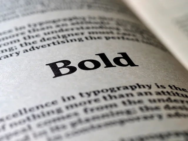 Focused image of the word 'Bold' in typography on a book page. When to check copywriting services UK regulations before publishing